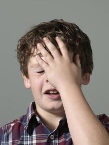 This stock photo child is so embarrassed.